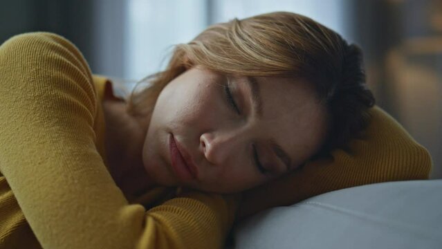 Closeup depressed woman thinking problems evening home. Frustrated girl anxiety