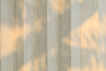 Concrete Corrugated wall with sunlight. Abstract Background outside of building. Rough grey texture...