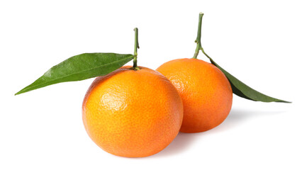 Fresh ripe juicy tangerines with green leaves isolated on white
