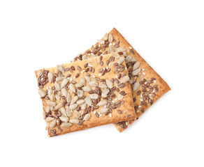Cereal crackers with flax, sunflower and sesame seeds isolated on white, top view
