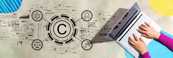 Copyright concept with person using a laptop computer