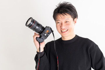 スタジオ撮影するカメラマン　photographer shooting in studio