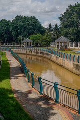 The river in the beautiful Serpong city park with a bright sky as a background. - obrazy, fototapety, plakaty