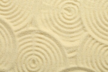Zen rock garden. Circle patterns on beige sand, top view
