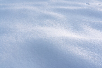 natural Snowdrift in sunny day. Nature Winter snow texture background.