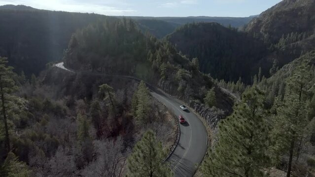 Highway 89A in Sedona, Arizona with mountains and cars driving with drone video stable.