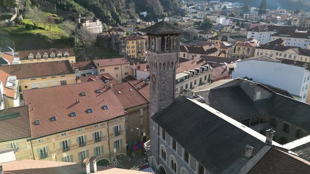 Bellinzona Switzerland rising view of church tower with busy city square below