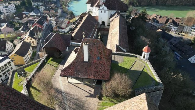 Aarburg Aargau Switzerland castle aerial from above showing busy village and lake