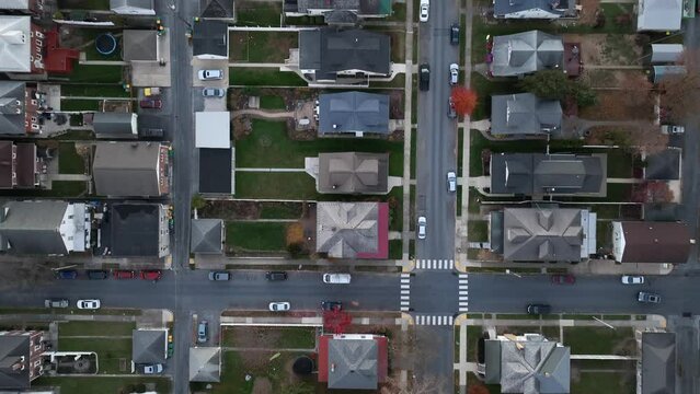Top down view of city suburb housing in America. Aerial view at dusk in autumn.