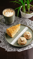 cappuccino in a mug and dessert on a plate. coffee shop menu