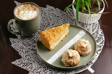 cappuccino in a mug and dessert on a plate. coffee shop menu
