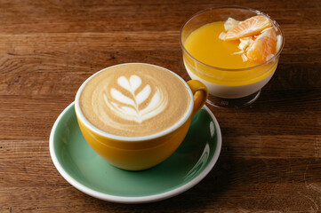 cappuccino in a mug and dessert on a plate. coffee shop menu