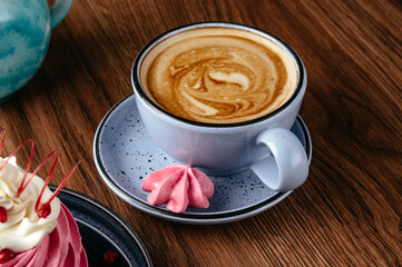 cappuccino in a mug and dessert on a plate. coffee shop menu