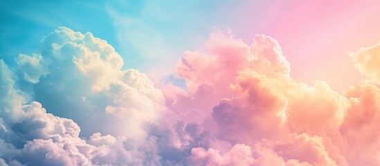 Abstract and pastel colors create a vibrant sky with soft clouds, perfect for a postcard background.