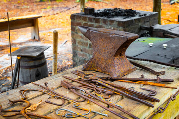Set of vintage blacksmith tools on the table outdoors