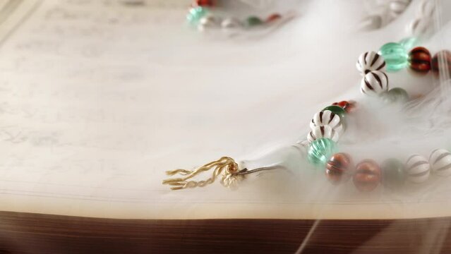 Religion The Book of Islam Quran and Rosary Beads