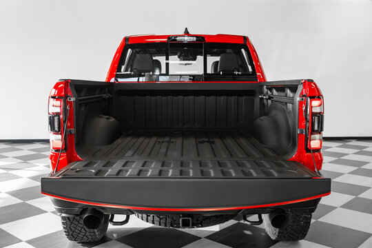 Clean, open empty trunk in the  red   car  pickup  in parking