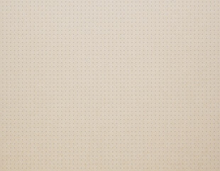 Beige paper texture with dots close up background