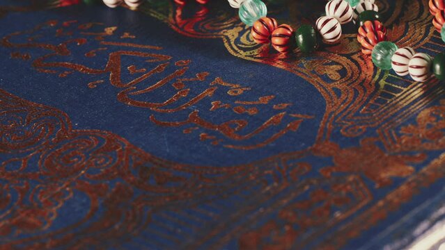 Religion The Book of Islam Quran and Rosary Beads