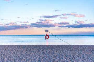 need a lifeline?: rescue equipment on a pole at a public beach on lake ontario shot kew beach in...