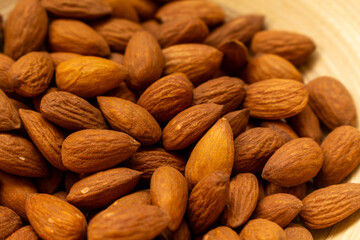 Heap of almonds, food background.