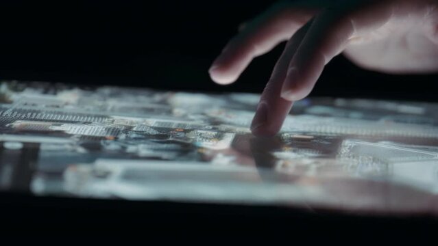 Person navigating a 3D city map on a tablet touchscreen. Close up, slow motion. 