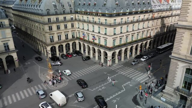 Place des Pyramides and Jeanne d'Arc statue in Paris city center, France. Aerial top-down view
