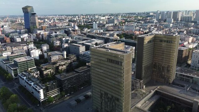 French National Library Or Bibliotheque Nationale Francois Mitterrand With Tours Duo Skyscrapers In Background, Paris Cityscape, France. Aerial Drone Orbiting