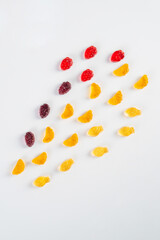 Fruit gummi candies assortment on white background 