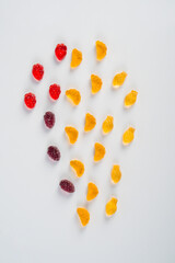 Fruit gummi candies assortment on white background 