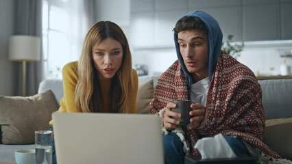 Pair virtual doctor visit talking laptop at room closeup. Sick man drinking tea - Powered by Adobe