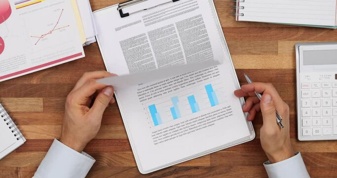 Partner checkups reports and signs contract at table