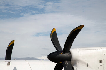 The exterior of a white propeller airplane in Luang Prabang, Laos