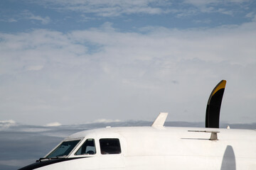 The exterior of a white propeller airplane in Luang Prabang, Laos