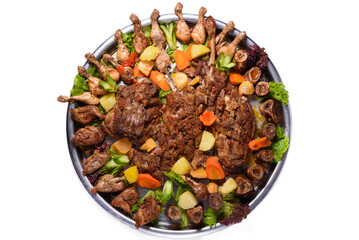 cold cuts of chicken, lamb and beef with potatoes and carrots, on a white background