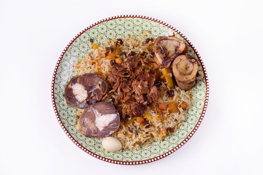 Pilaf with kazy and bones with bone marrow, on a white background