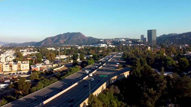 Tracking drone shot of Route 101 in Studio City, California.