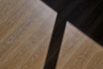 Photo of light falling and shadows on a wooden floor