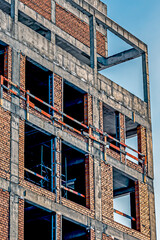 A fragment of the wall of a building under construction on a winter day