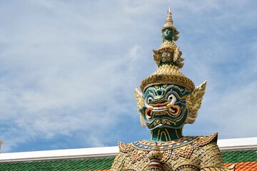 Close-up of Thotsakan, one of two giant statues - characters from the Ramakien epic - guarding the...