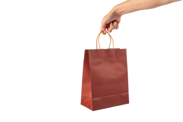 Red paper shopping bag in hand on transparent background.