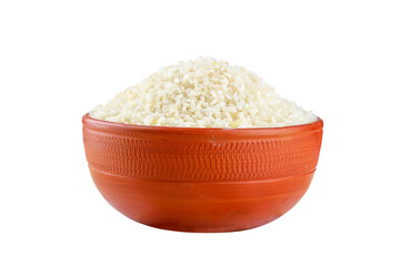 White rice in a clay bowl isolated on a white background
