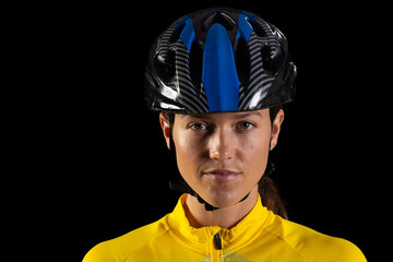 Young Caucasian woman wearing a cycling helmet, with copy space