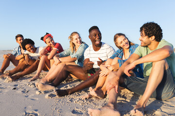 Fototapeta premium Diverse group of friends enjoying a day at the beach