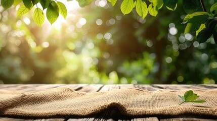 Nature background and table wood for product display template, Empty wooden table and sack tablecloth over blur green tree at park, garden outdoor with bokeh light background - obrazy, fototapety, plakaty