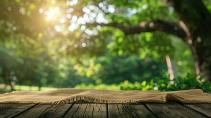 Nature background and table wood for product display template, Empty wooden table and sack tablecloth over blur green tree at park, garden outdoor with bokeh light background - obrazy, fototapety, plakaty