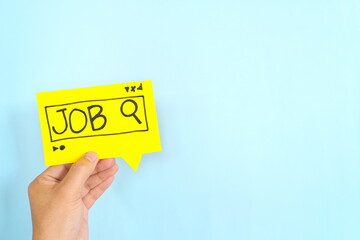 Human hand holding job search signage. New job searching or hunt concept.