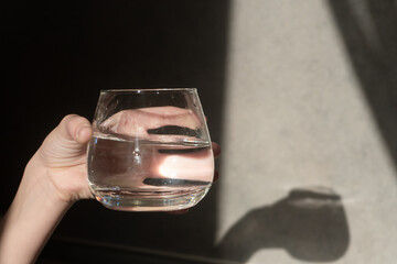 A glass of clean water in a child's hand