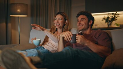 Excited family watch comedy movie have good time evening room together closeup