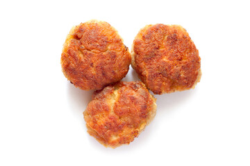Three homemade meat patties on a white background. Top view. Close-up of meatballs. With a shadow.